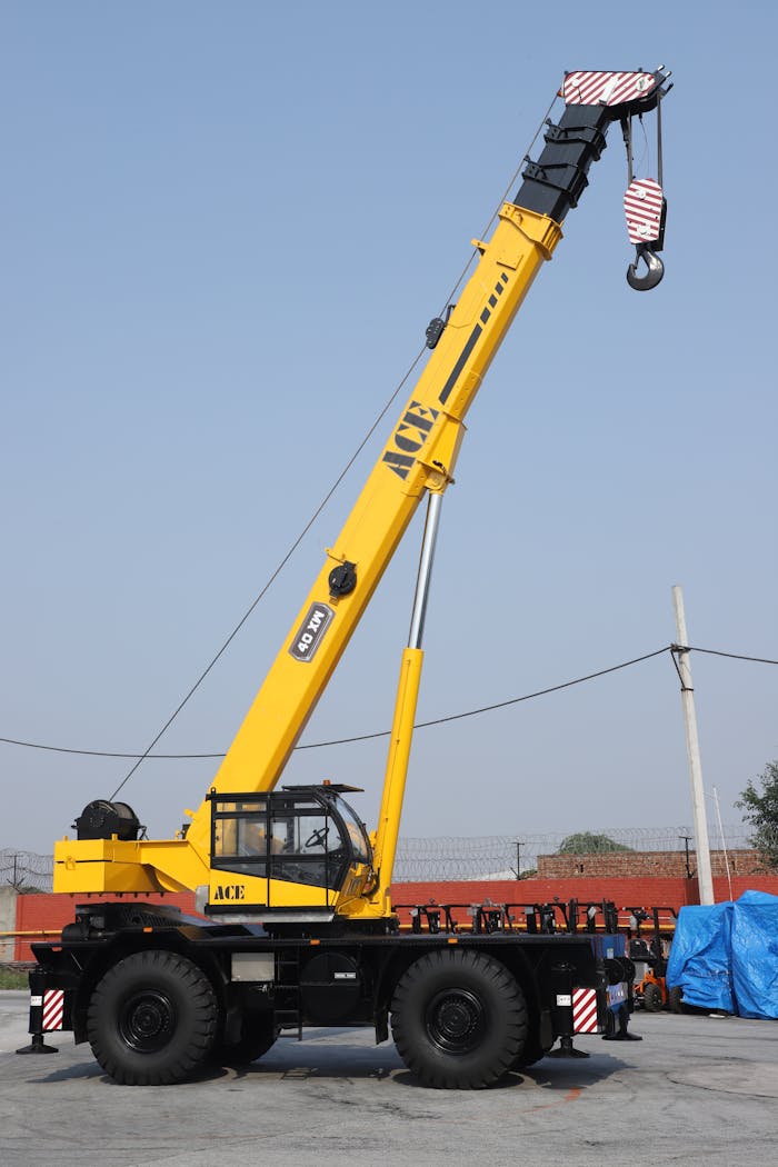portfolio-02 A yellow ACE 40XW rough terrain crane in an outdoor setting in Faridabad, India.